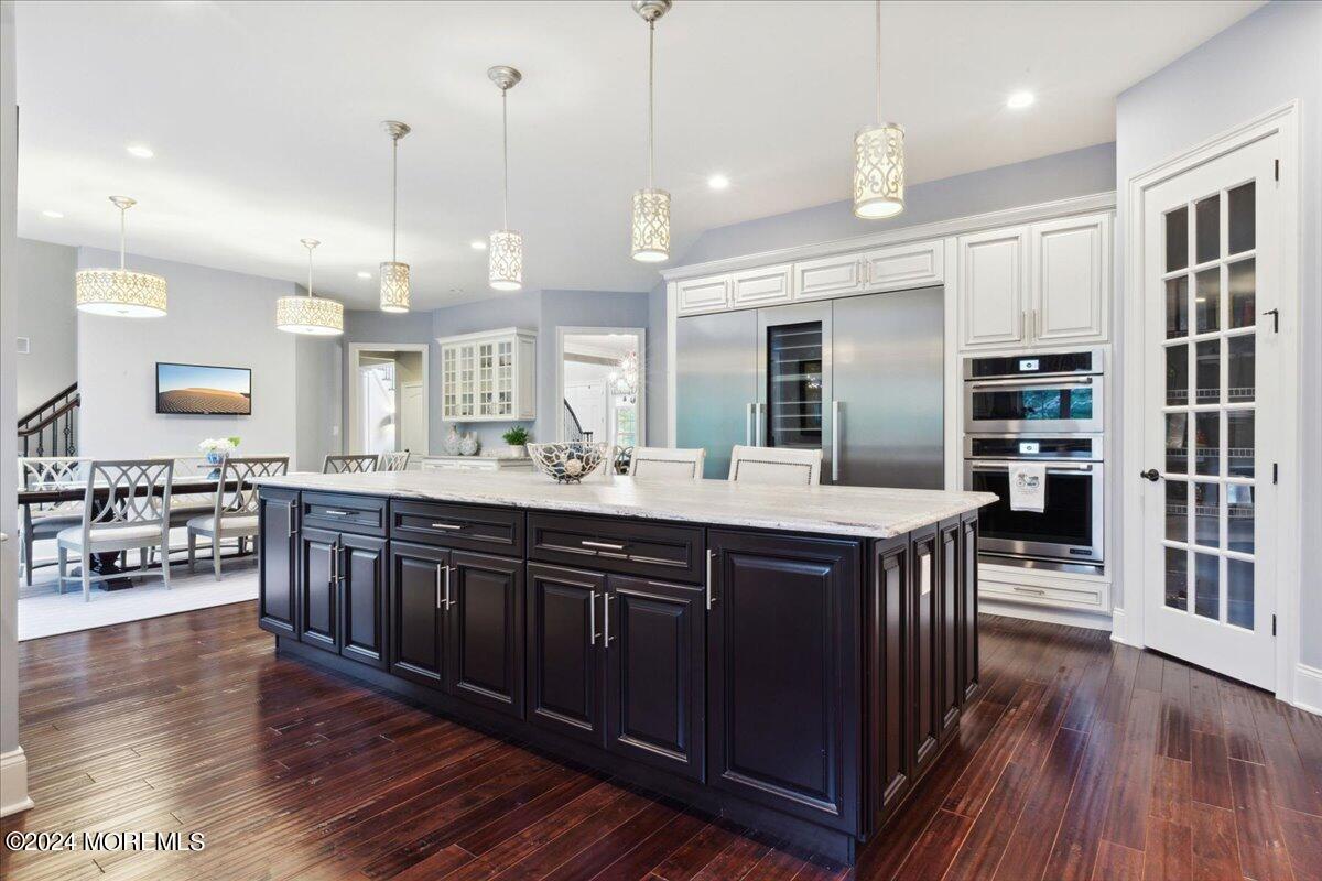34 Windermere Road Lincroft, NJ 07738 - Photo 29 of 78 a kitchen with kitchen island granite countertop a sink counter top space and cabinets