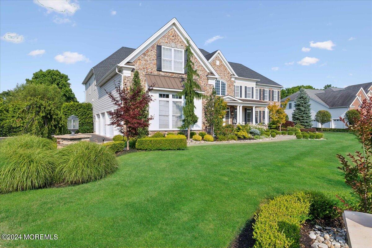 34 Windermere Road Lincroft, NJ 07738 - Photo 3 of 78 a front view of a house with a yard