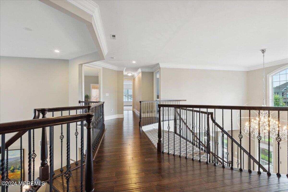 34 Windermere Road Lincroft, NJ 07738 - Photo 36 of 78 a view of a hallway with wooden floor