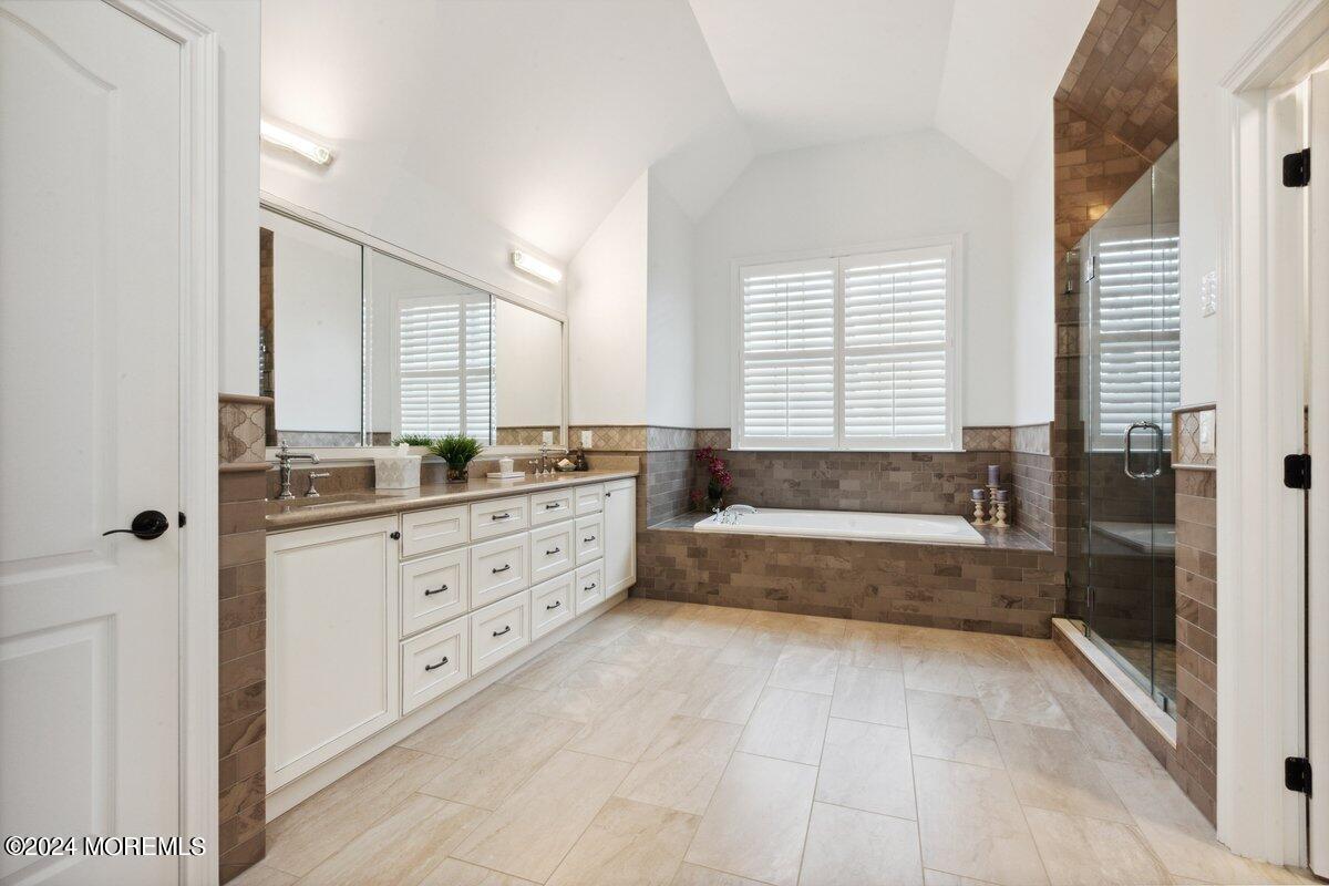 34 Windermere Road Lincroft, NJ 07738 - Photo 40 of 78 a spacious bathroom with a tub sink and mirror