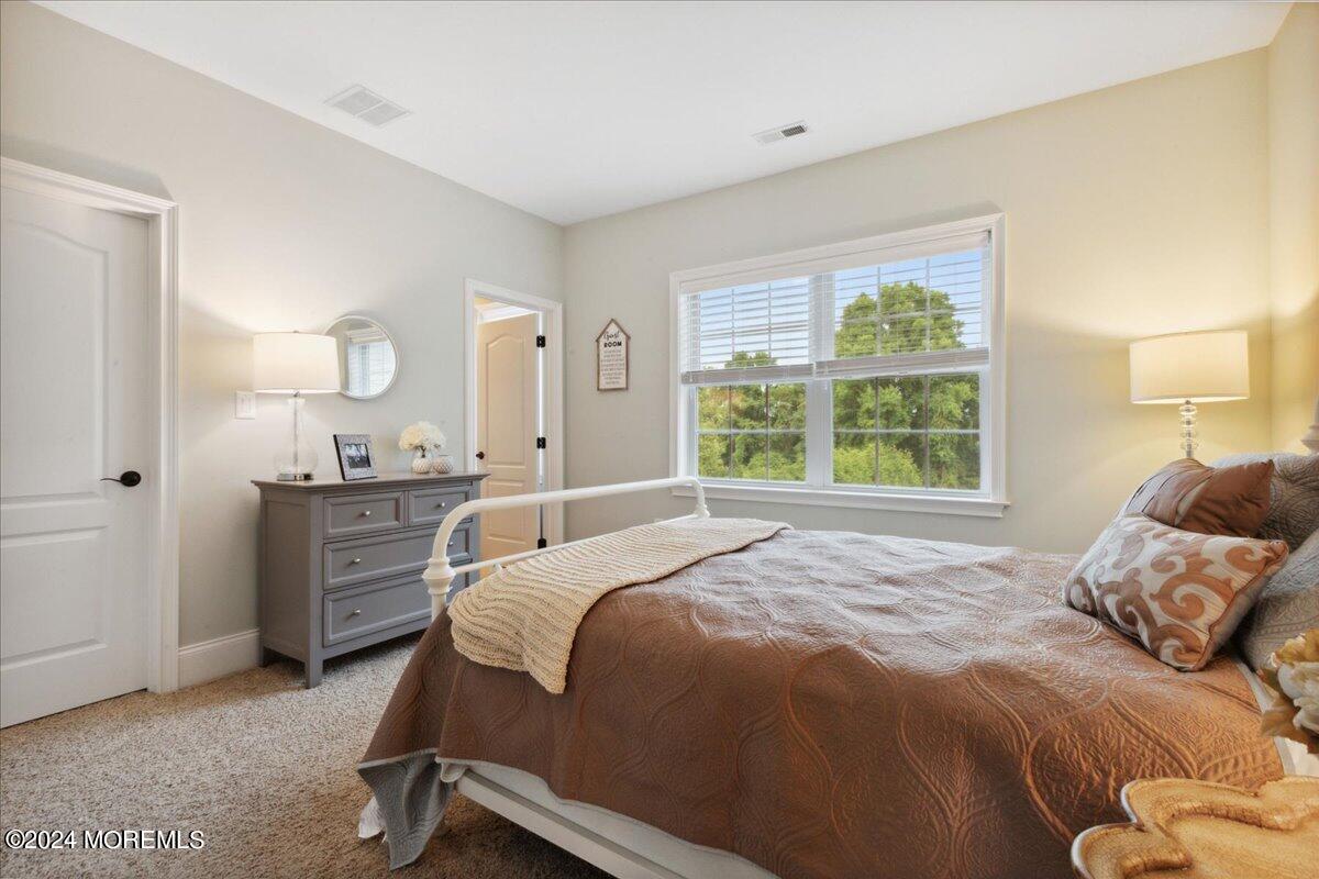 34 Windermere Road Lincroft, NJ 07738 - Photo 44 of 78 a bedroom with a bed and a dresser