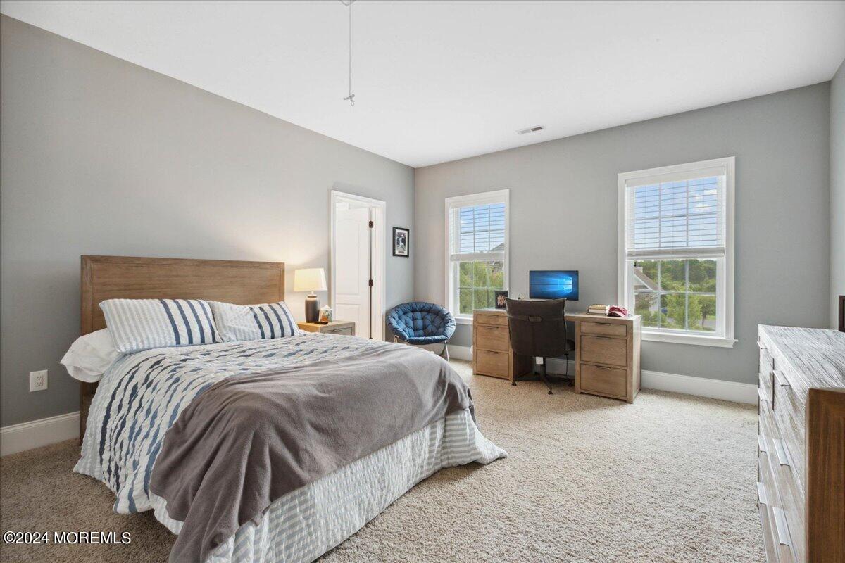 34 Windermere Road Lincroft, NJ 07738 - Photo 46 of 78 a bedroom with a bed and a couch