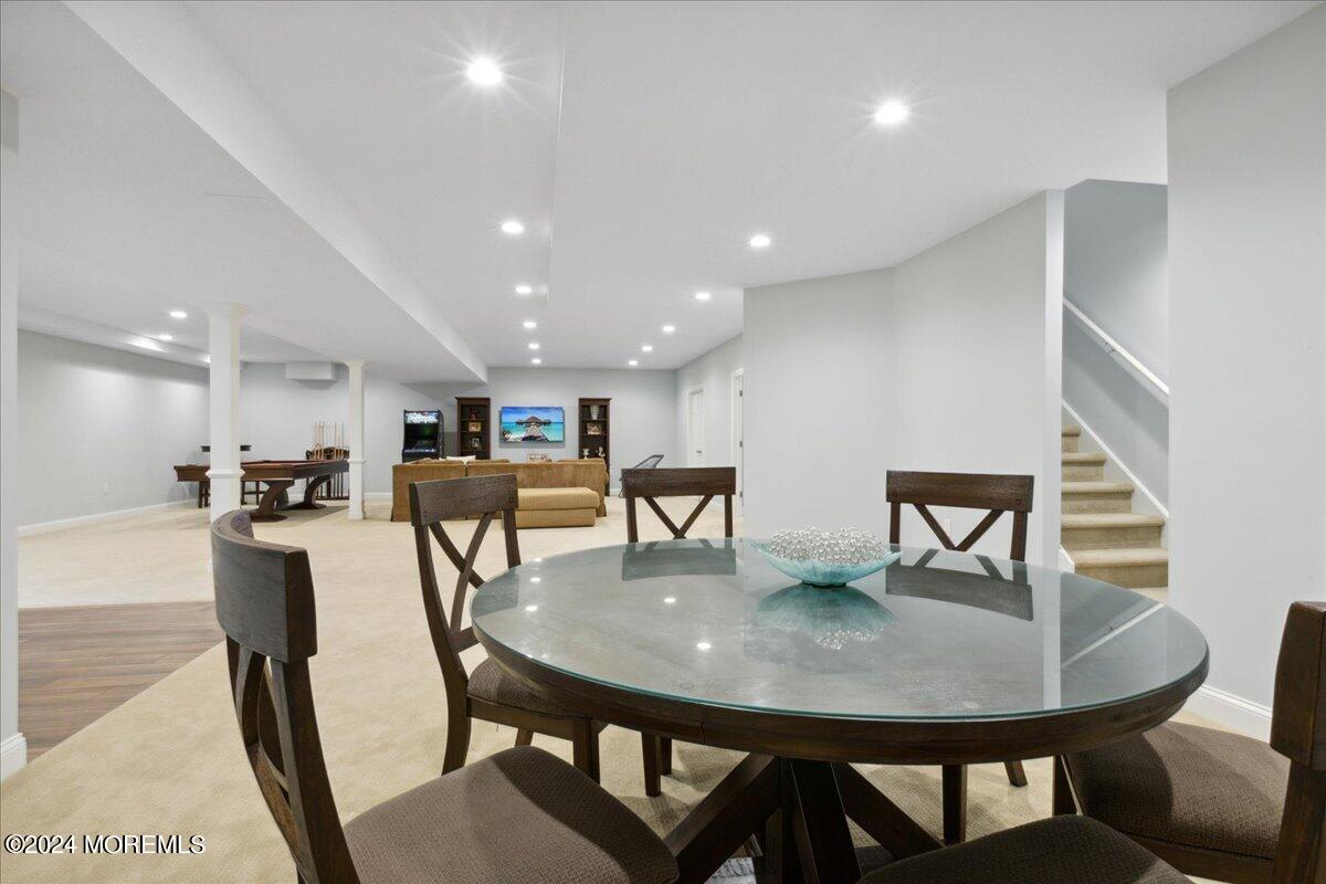 34 Windermere Road Lincroft, NJ 07738 - Photo 52 of 78 a view of a dining room with furniture and wooden floor