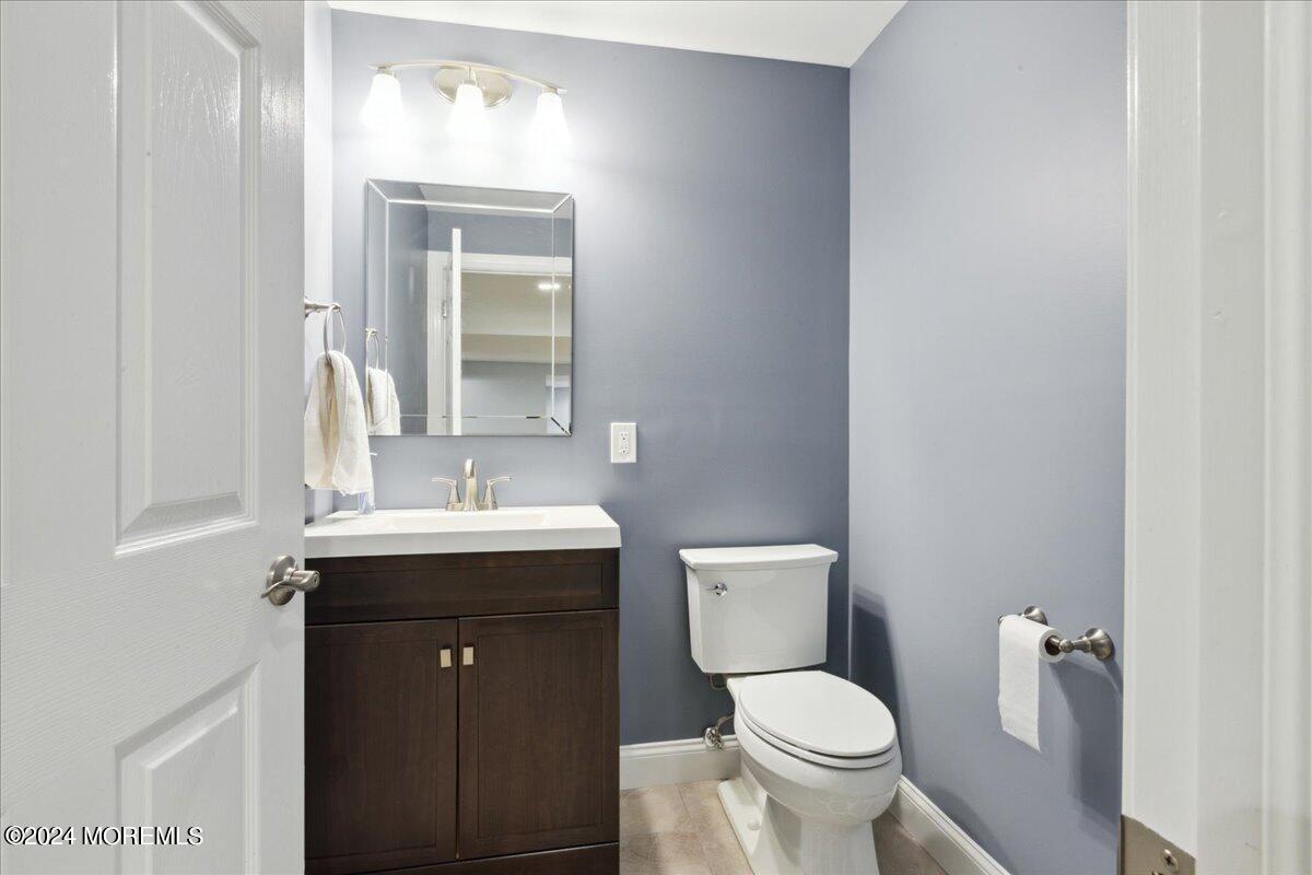 34 Windermere Road Lincroft, NJ 07738 - Photo 55 of 78 a bathroom with a toilet sink and mirror