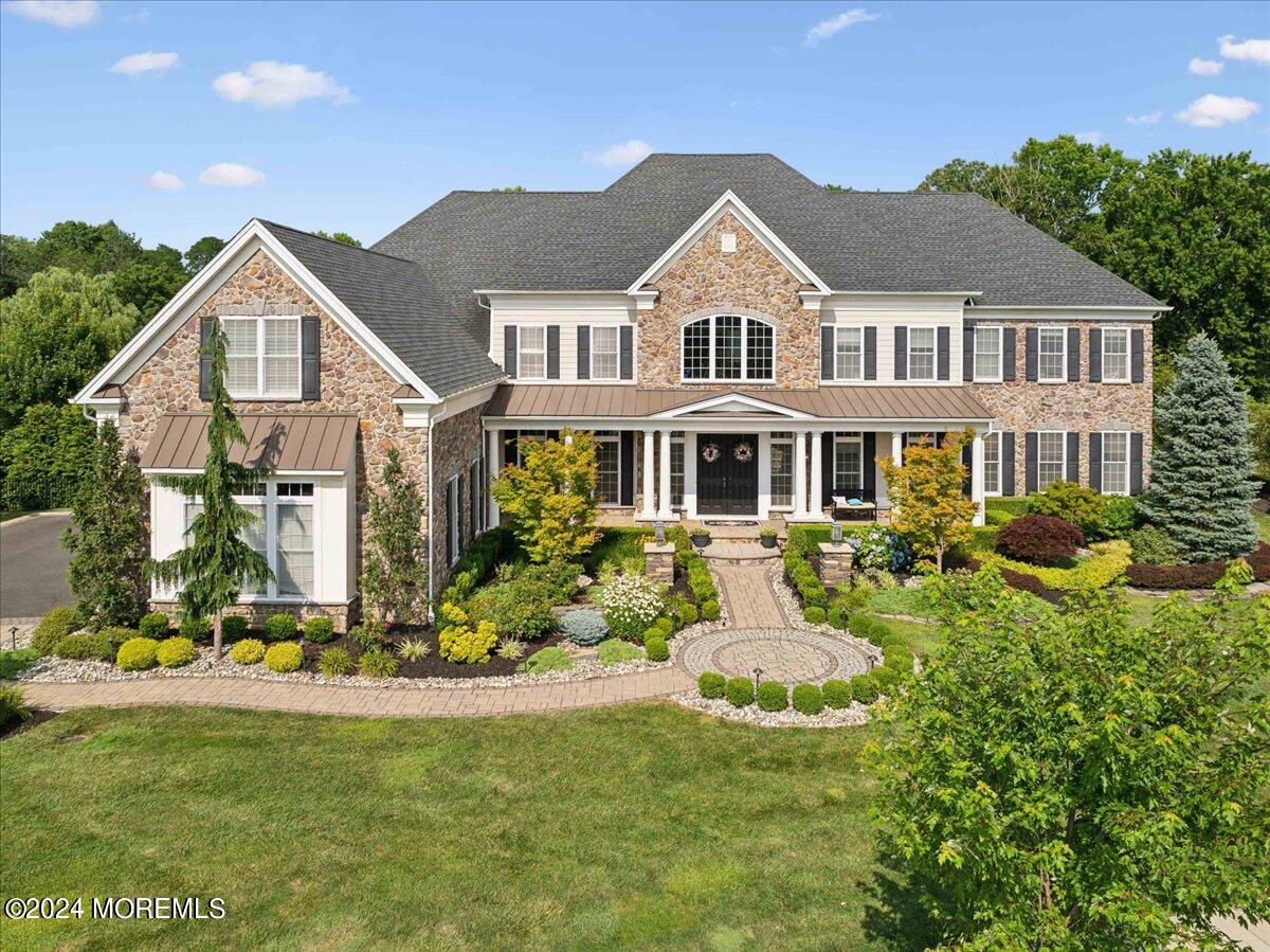 34 Windermere Road Lincroft, NJ 07738 - Photo 64 of 78 a front view of a house with a yard