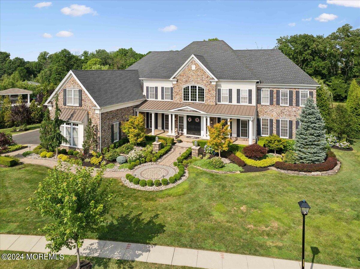 34 Windermere Road Lincroft, NJ 07738 - Photo 66 of 78 a view of a house with swimming pool and garden