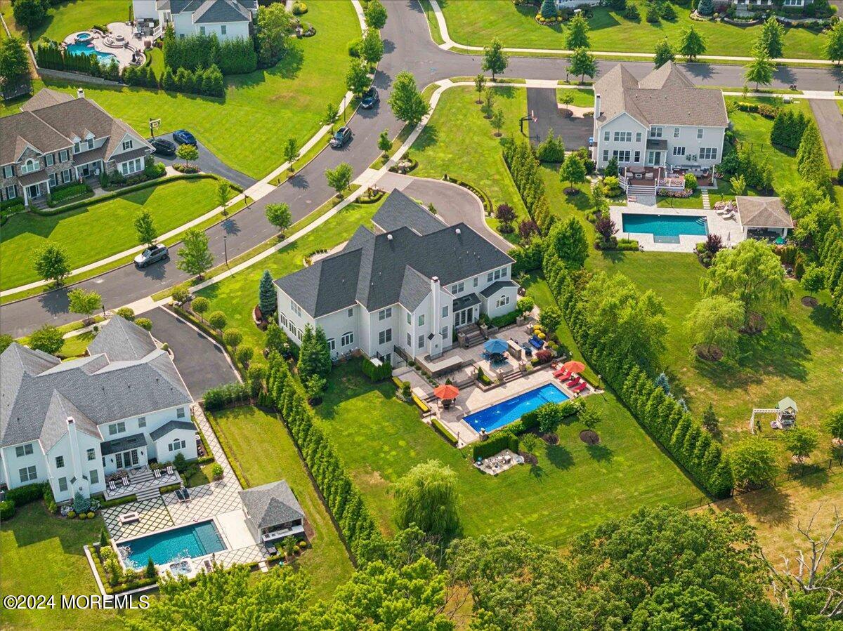 34 Windermere Road Lincroft, NJ 07738 - Photo 71 of 78 an aerial view of residential houses with outdoor space and swimming pool