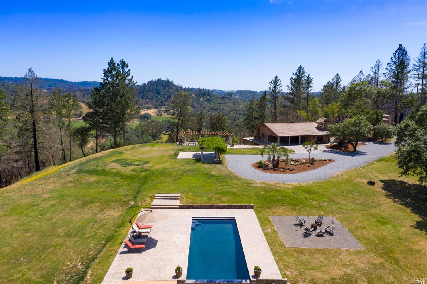5656 Tremonte Lane Healdsburg, CA 95448 - Photo 1 of 1 a view of a swimming pool with a patio