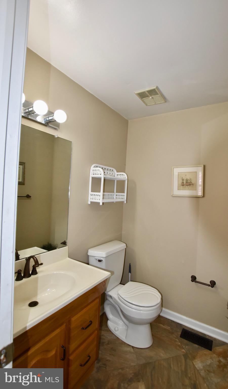 44 West Brookline Drive Laurel Springs, NJ 08021 - Photo 11 of 39 a bathroom with a toilet sink and mirror