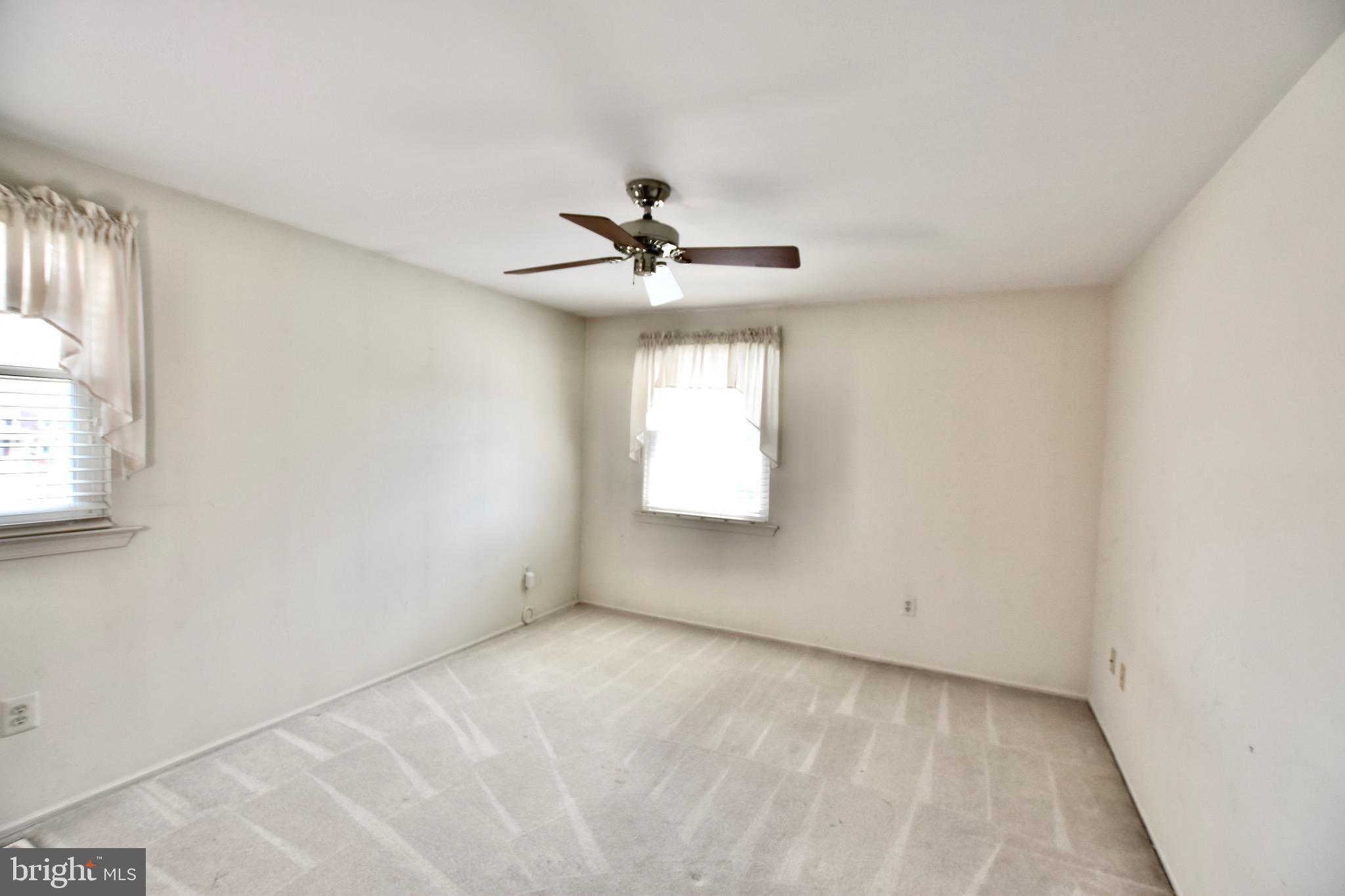 44 West Brookline Drive Laurel Springs, NJ 08021 - Photo 25 of 39 an empty room with windows and ceiling fan