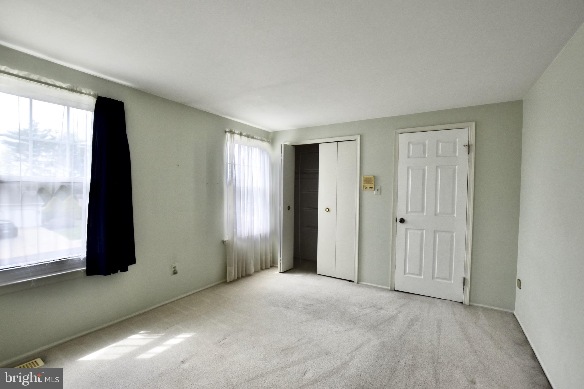 44 West Brookline Drive Laurel Springs, NJ 08021 - Photo 28 of 39 a view of an empty room with window and closet area