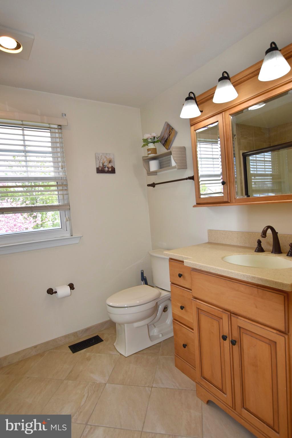 44 West Brookline Drive Laurel Springs, NJ 08021 - Photo 30 of 39 a bathroom with a toilet sink and mirror