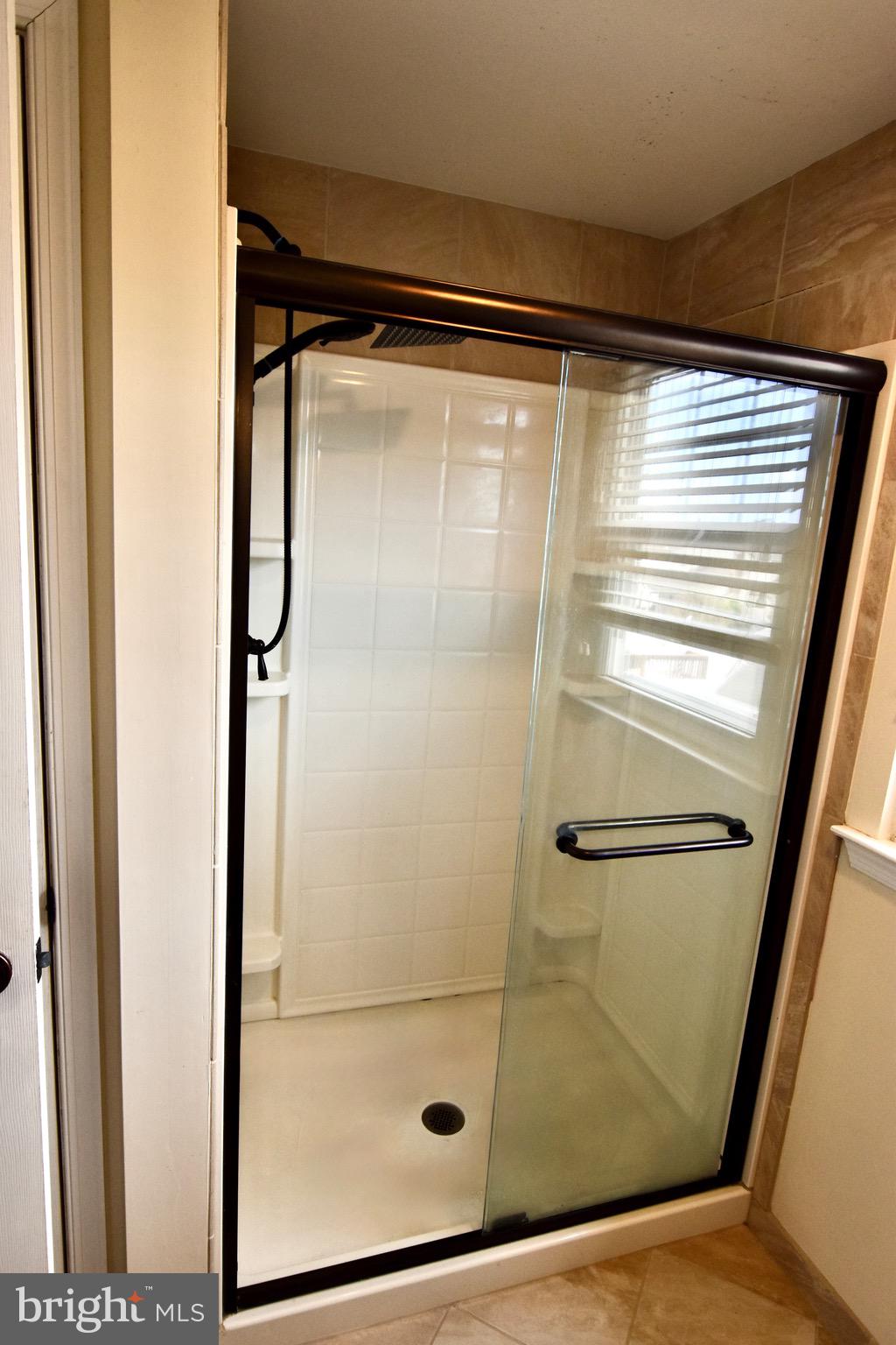 44 West Brookline Drive Laurel Springs, NJ 08021 - Photo 31 of 39 a bathroom with a glass shower door