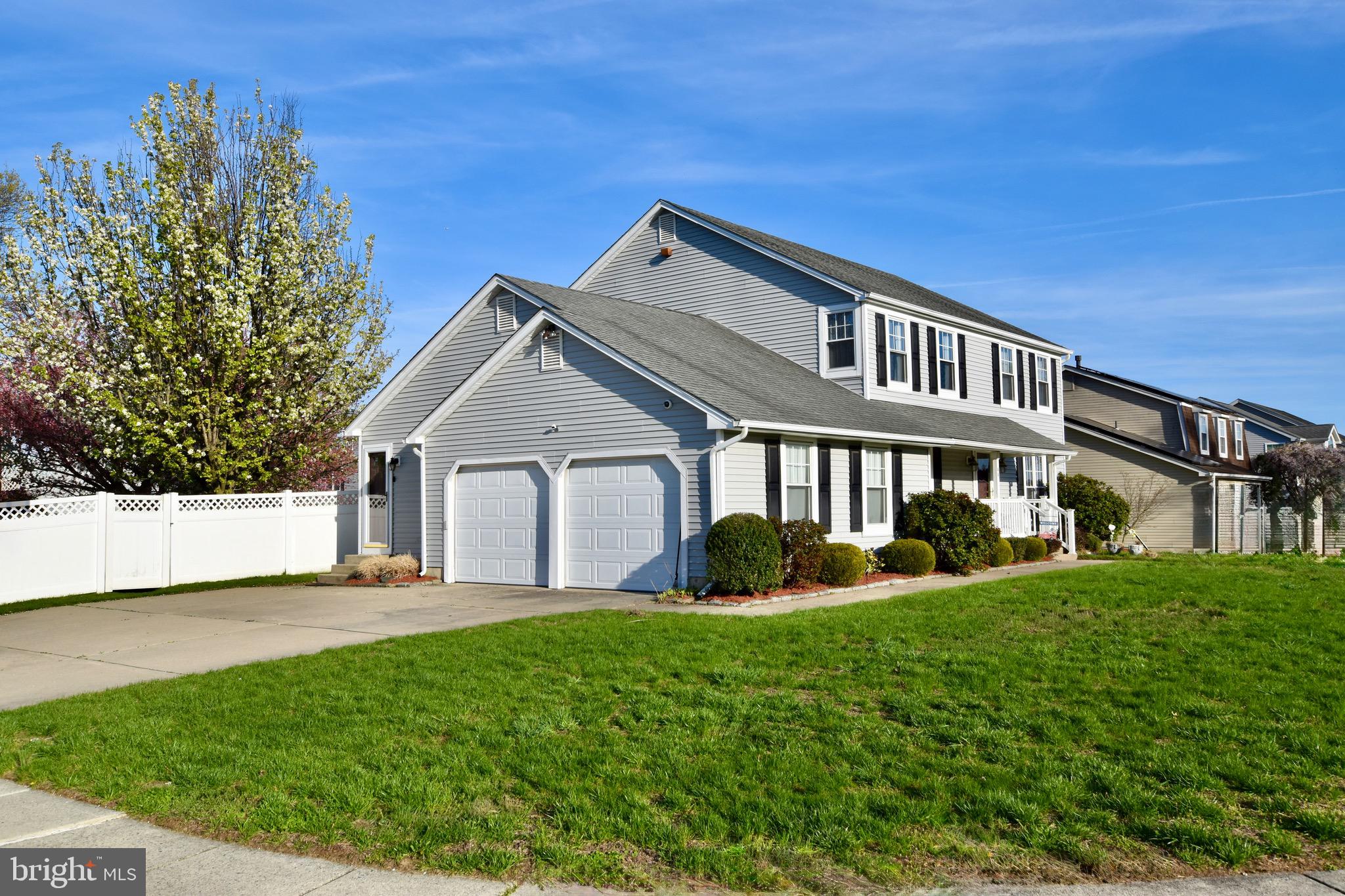 44 West Brookline Drive Laurel Springs, NJ 08021 - Photo 5 of 39 a front view of a house with a yard and potted plants