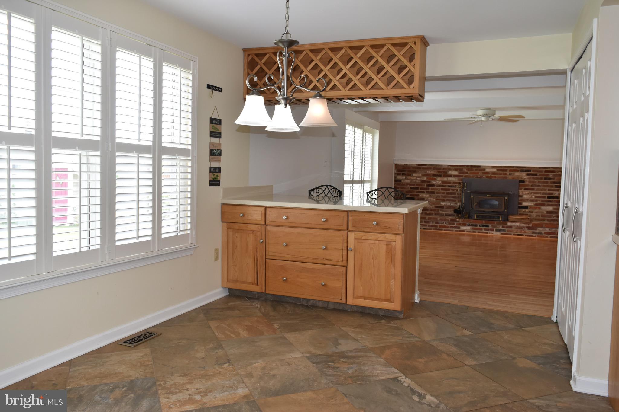 44 West Brookline Drive Laurel Springs, NJ 08021 - Photo 9 of 39 a kitchen with a sink window and cabinets