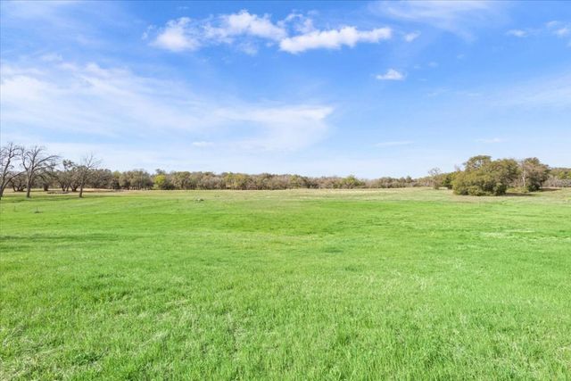 a view of building with yard