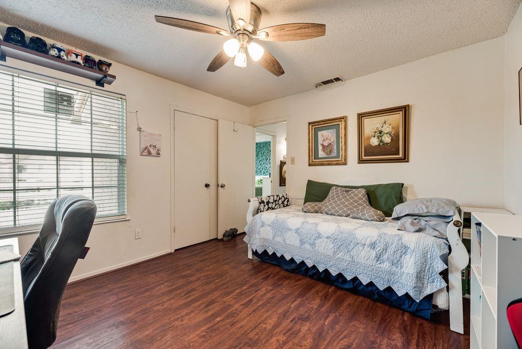 4273 Madera Road, Unit 4 Irving, TX 75038 - Photo 14 of 18 Guest Bedroom with newly painted walls and ceiling fan and new window