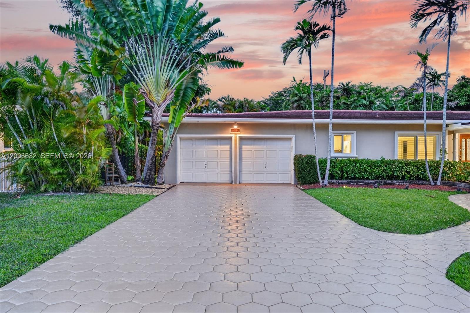 1435 Blue Road Coral Gables, FL 33146 - Photo 2 of 31 a house view with a garden space