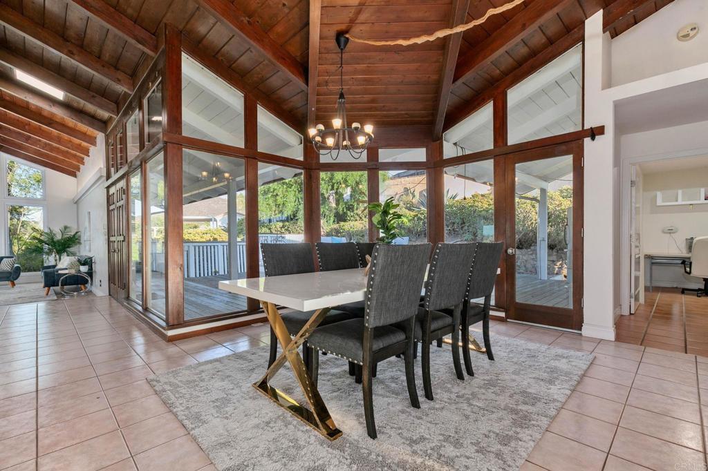 1628 Lone Oak Road Vista, CA 92084 - Photo 11 of 39 a view of a dining room with furniture window and wooden floor