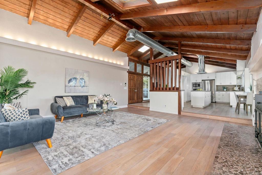 1628 Lone Oak Road Vista, CA 92084 - Photo 15 of 39 a living room with furniture and a rug