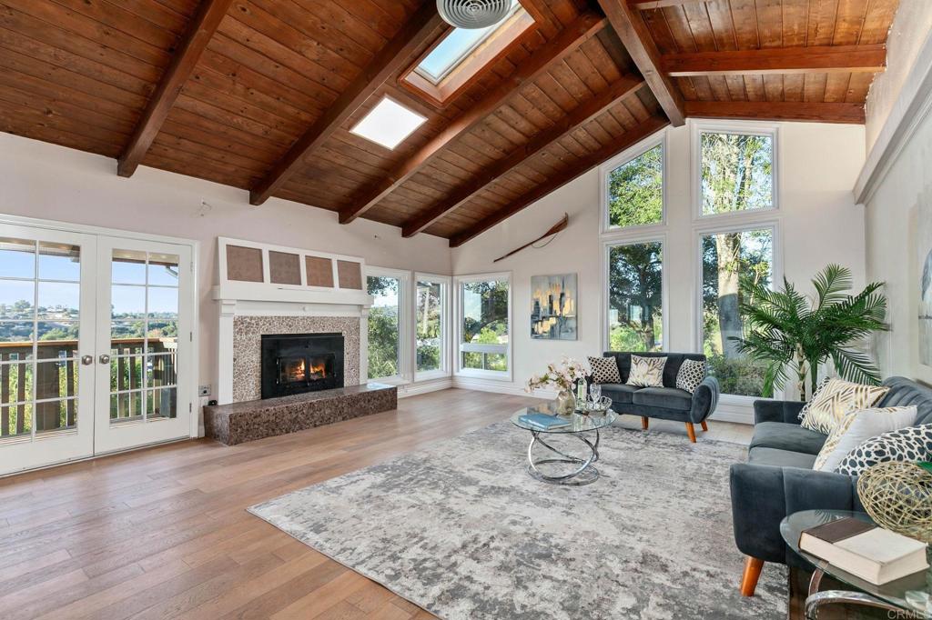 1628 Lone Oak Road Vista, CA 92084 - Photo 16 of 39 a living room with furniture and a fireplace