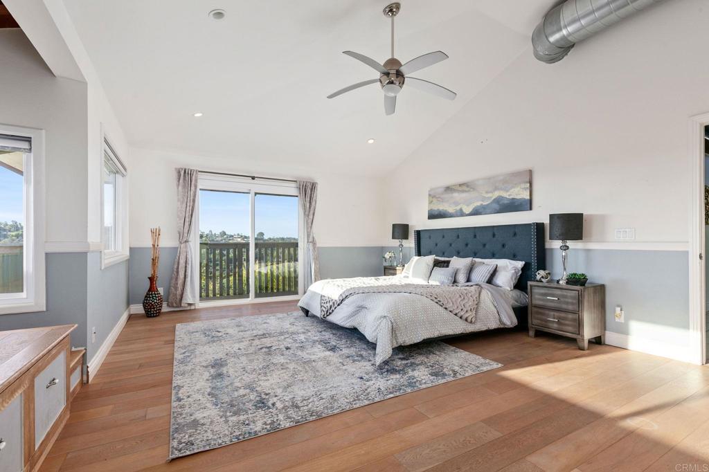 1628 Lone Oak Road Vista, CA 92084 - Photo 19 of 39 a bed sitting in a spacious bedroom next to a window