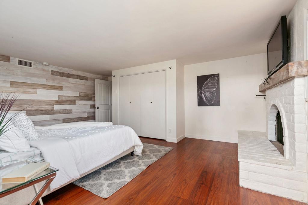 1628 Lone Oak Road Vista, CA 92084 - Photo 27 of 39 a bedroom with a bed and a flat screen tv