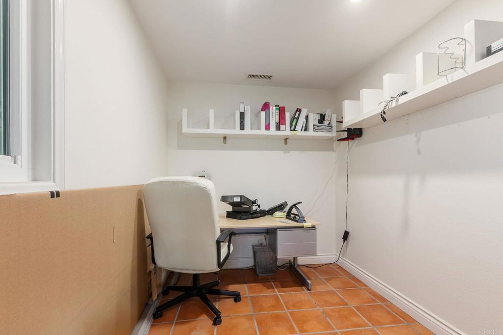 1628 Lone Oak Road Vista, CA 92084 - Photo 29 of 39 a view of a workspace with furniture and workspace