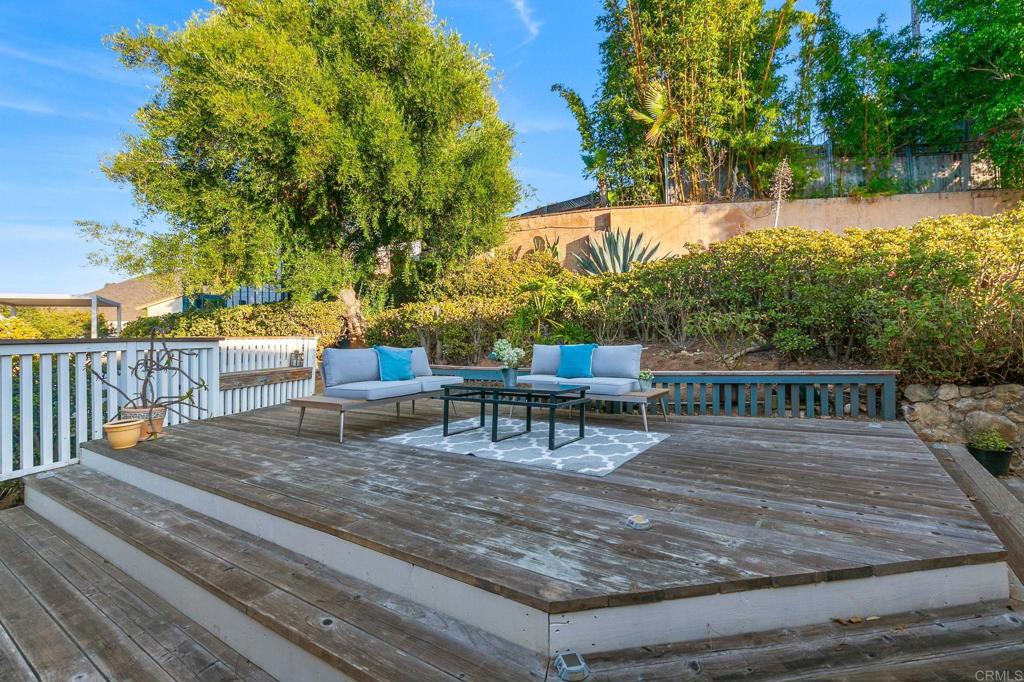 1628 Lone Oak Road Vista, CA 92084 - Photo 33 of 39 a view of a deck with wooden floor and fence