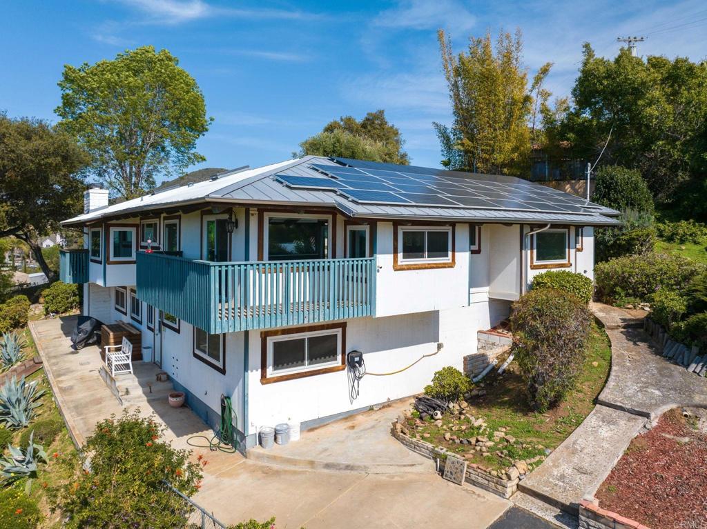 1628 Lone Oak Road Vista, CA 92084 - Photo 4 of 39 a view of a house with a yard and potted plants
