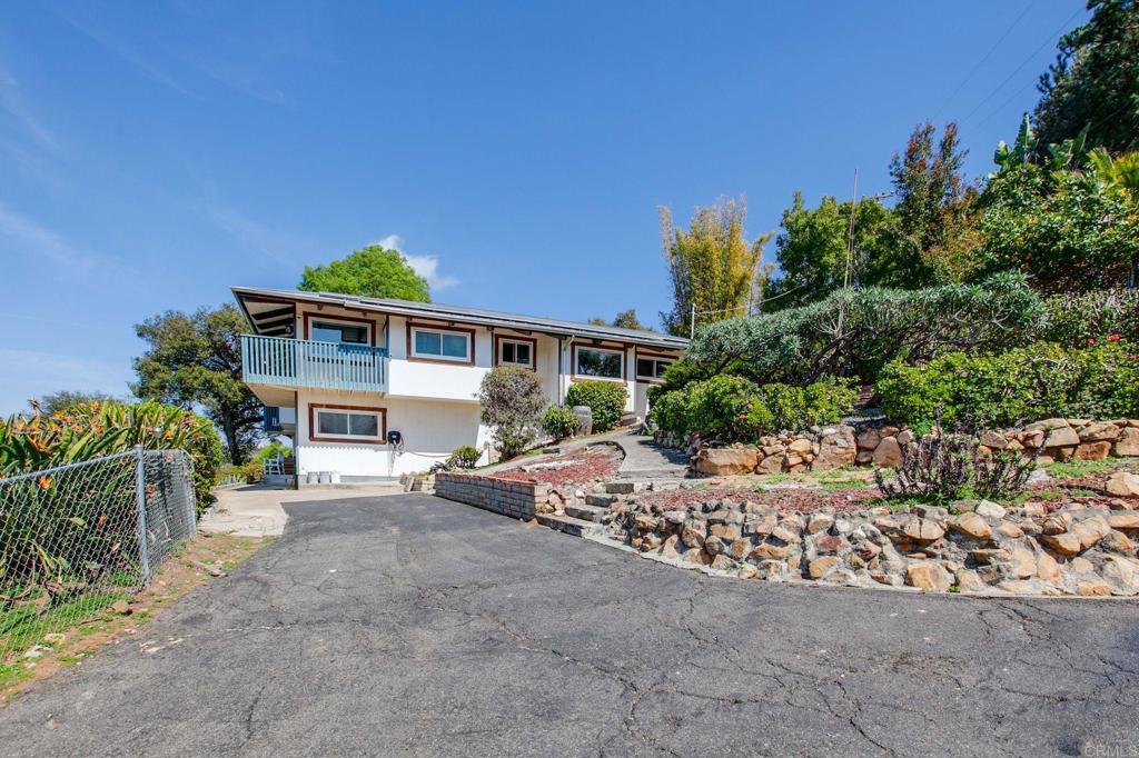 1628 Lone Oak Road Vista, CA 92084 - Photo 5 of 39 front view of a house with a street
