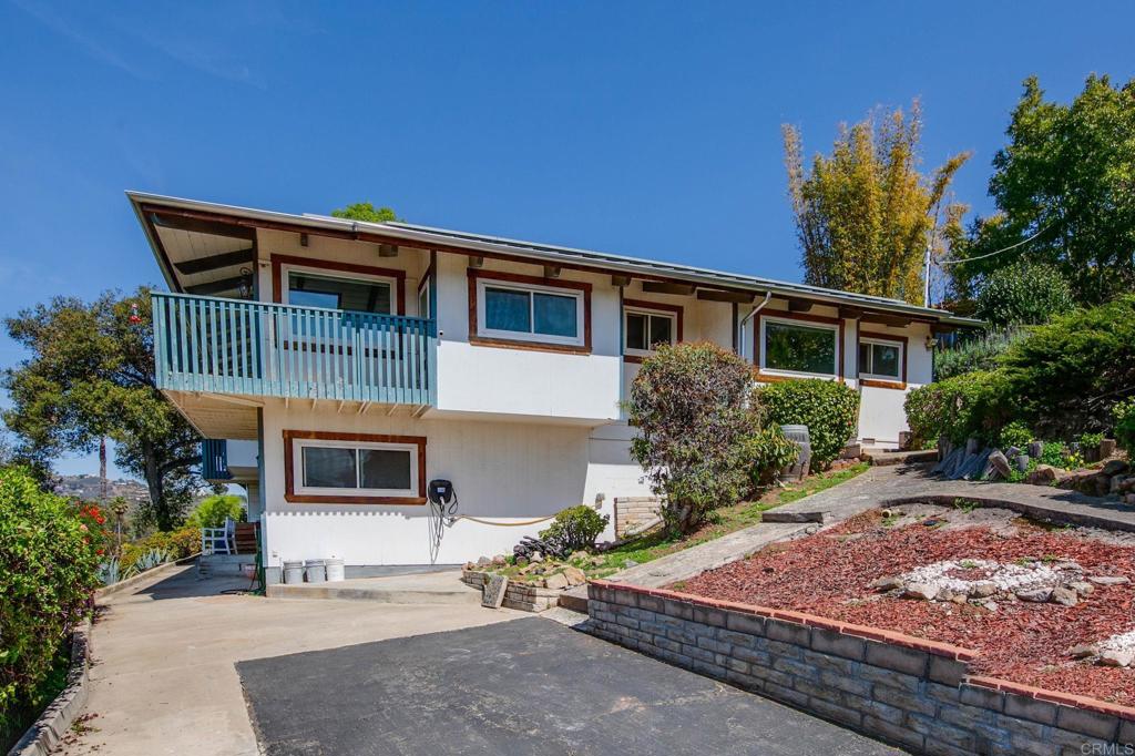 1628 Lone Oak Road Vista, CA 92084 - Photo 6 of 39 a front view of a house with garden