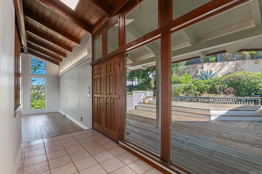 1628 Lone Oak Road Vista, CA 92084 - Photo 10 of 39 a view of a porch with wooden floor and stairs