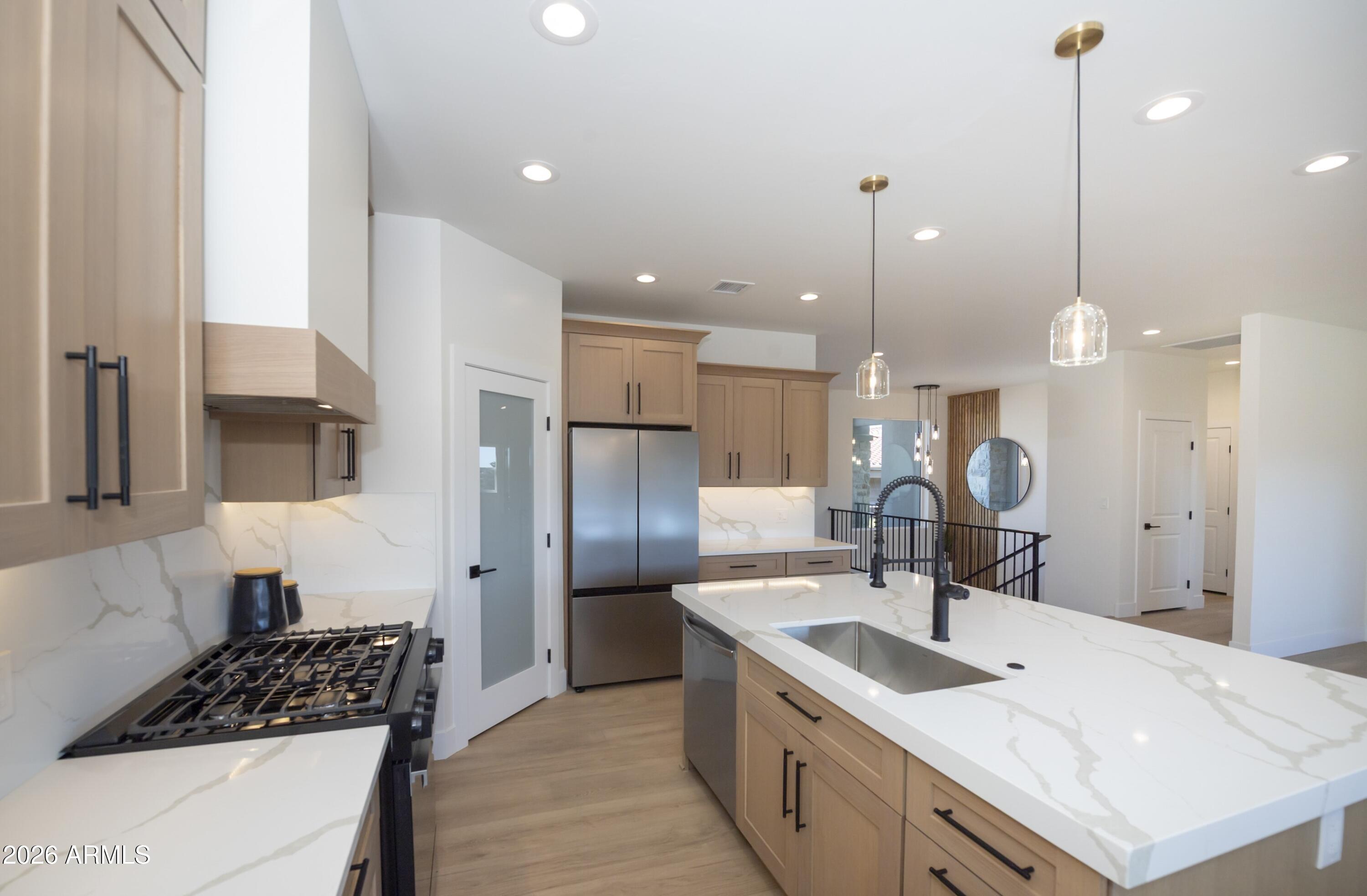10603 Straight Arrow Road Dewey, AZ 86327 - Photo 11 of 57 a kitchen with a sink stove and refrigerator