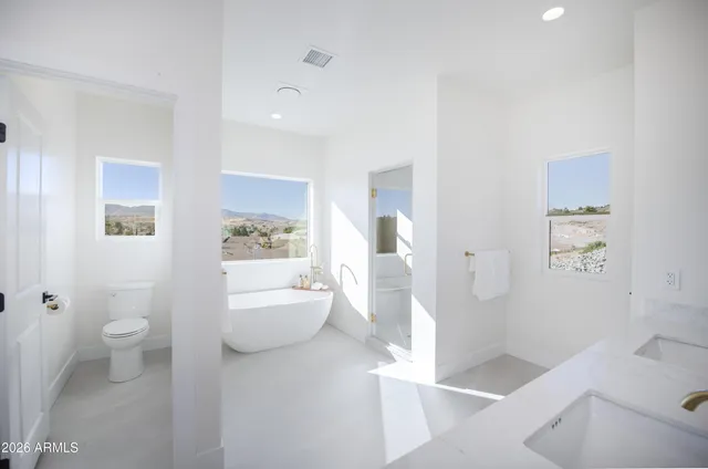 a bathroom with a sink a toilet and tub