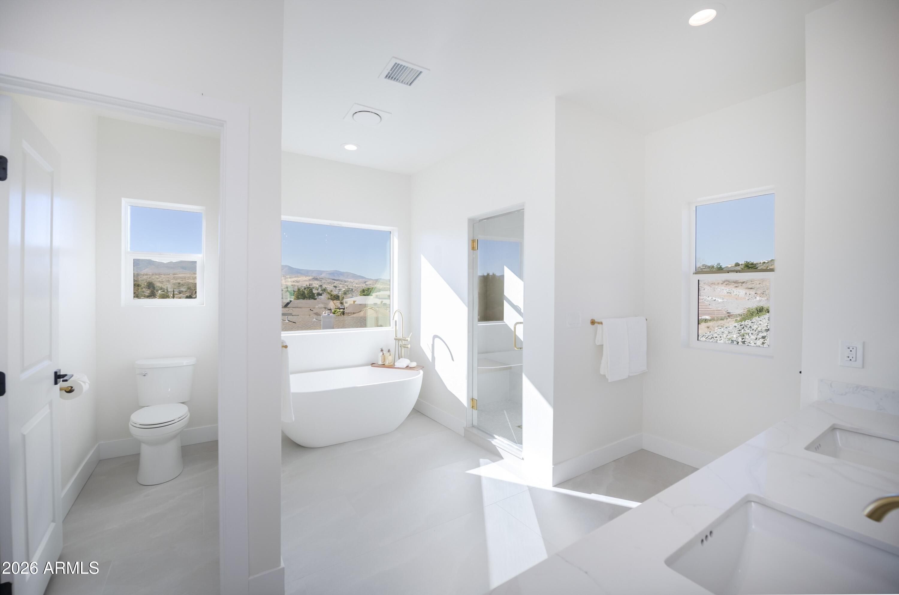 10603 Straight Arrow Road Dewey, AZ 86327 - Photo 16 of 57 a bathroom with a sink a toilet and tub