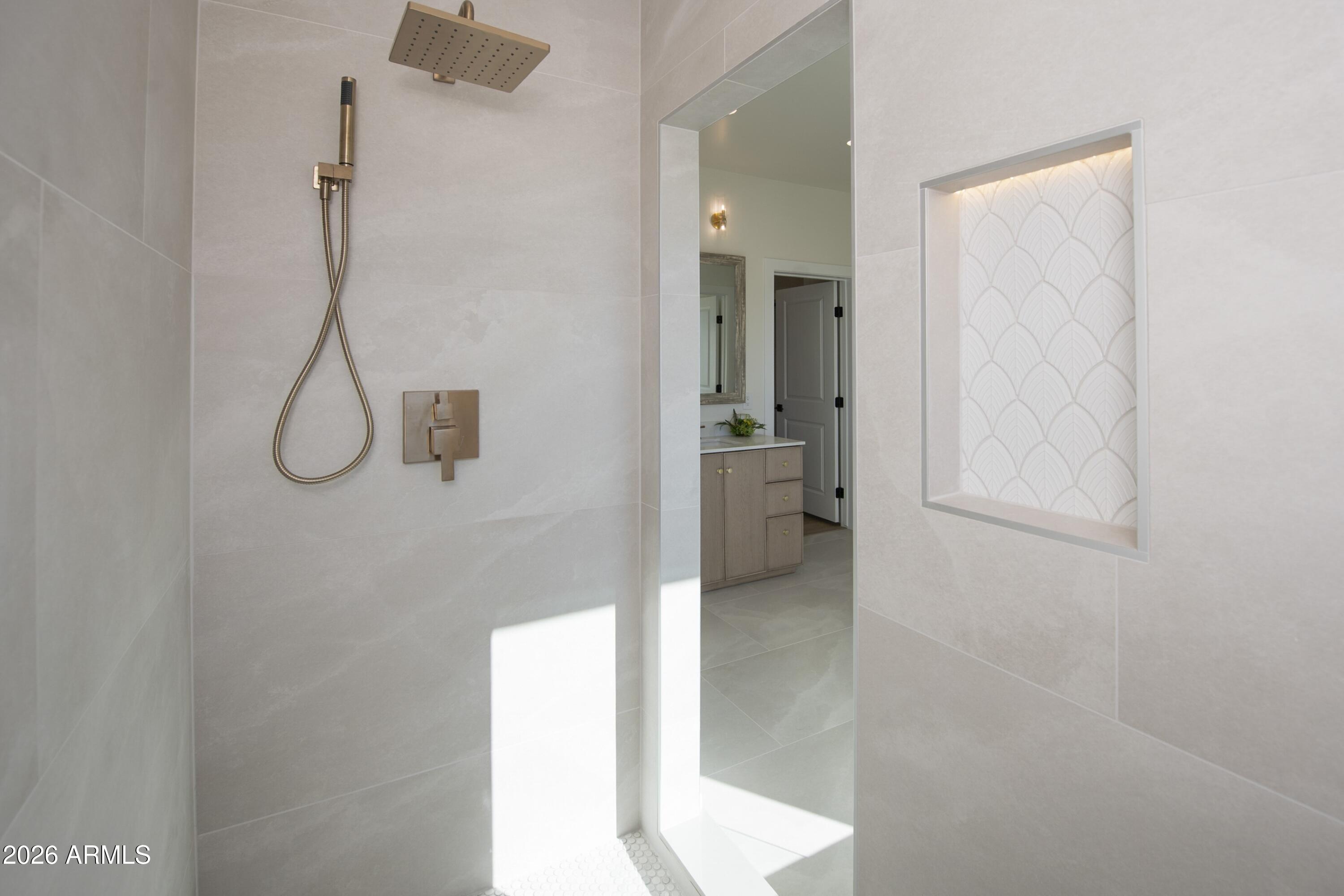 10603 Straight Arrow Road Dewey, AZ 86327 - Photo 18 of 57 a bathroom with a glass shower door