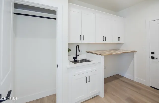 an empty room with a ceiling fan and a window