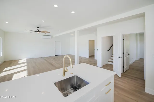 a bathroom with a double vanity sink toilet mirror and shower