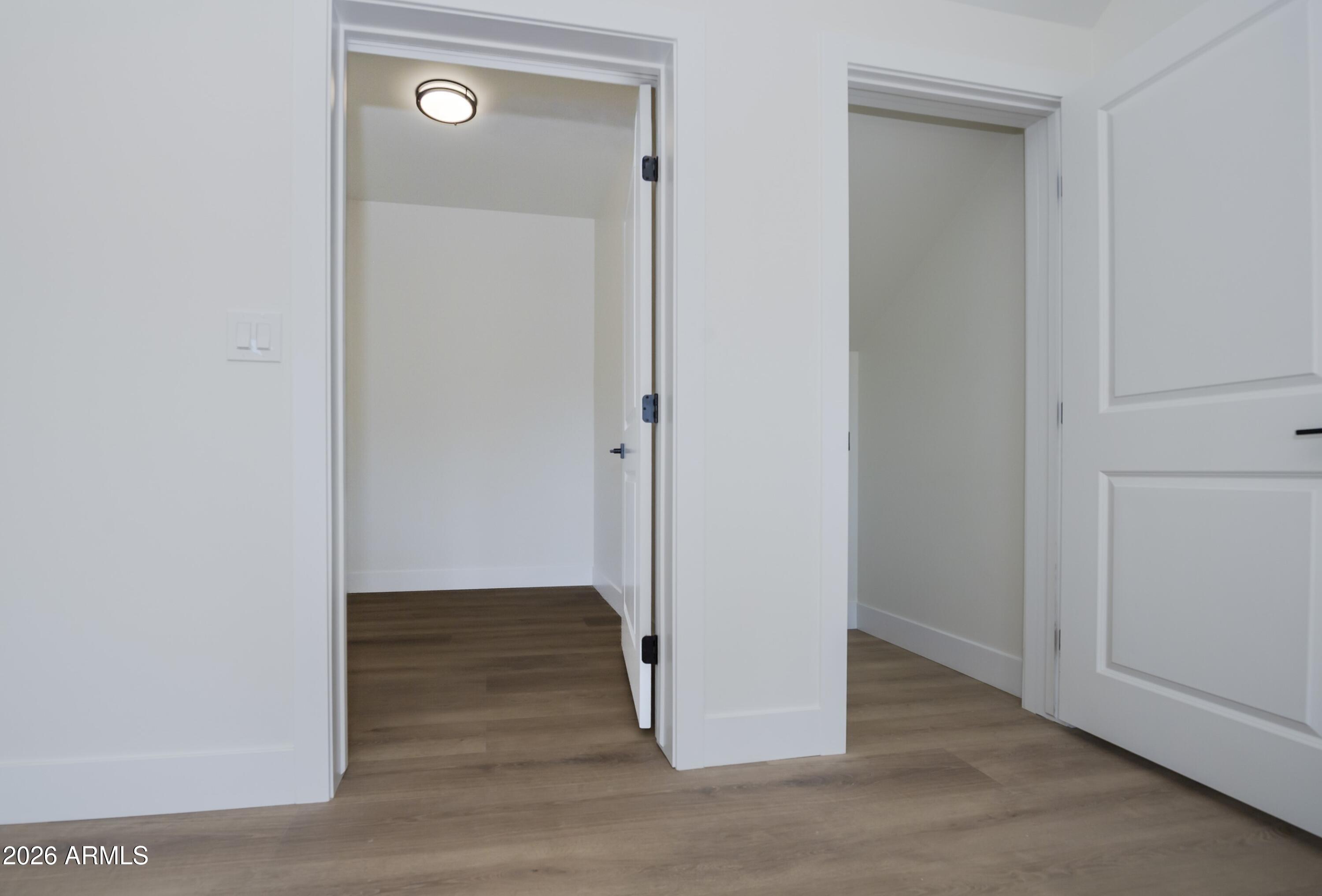 10603 Straight Arrow Road Dewey, AZ 86327 - Photo 38 of 57 a view of a hallway with wooden floor