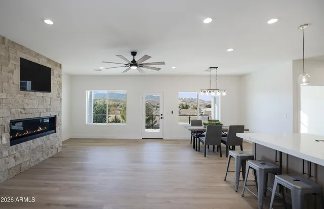 a view of a dining room with furniture window and wooden floor