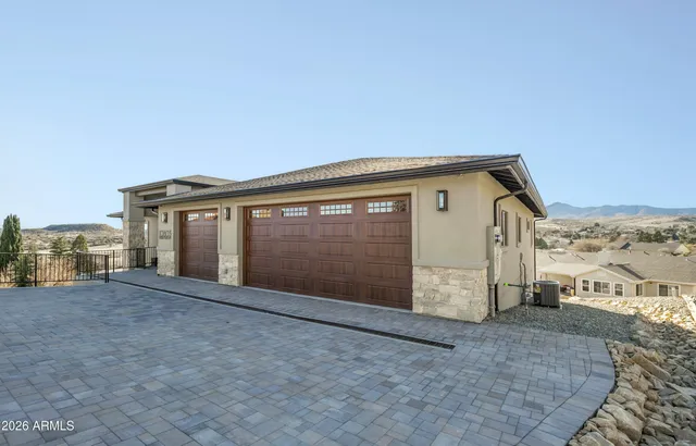 a view of a livingroom with a furniture wooden floor and a ceiling fan