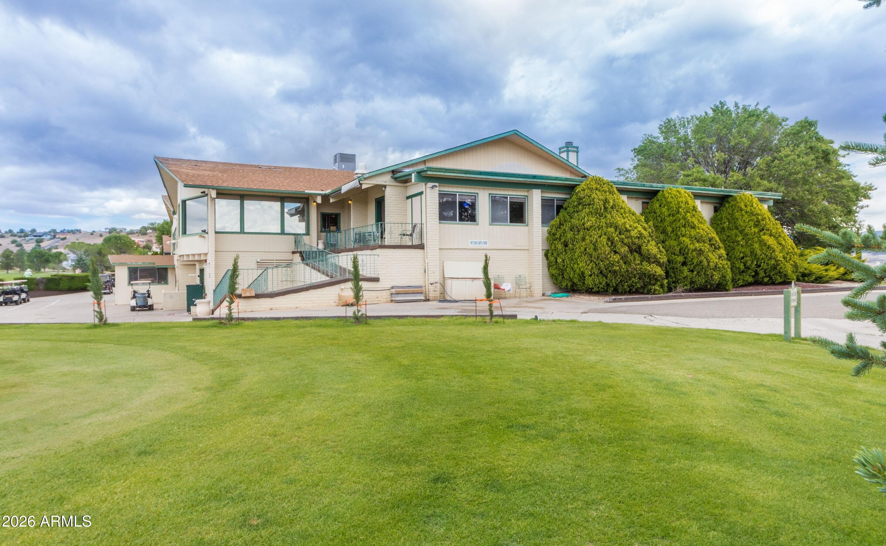 10603 Straight Arrow Road Dewey, AZ 86327 - Photo 54 of 57 a front view of a house with a yard