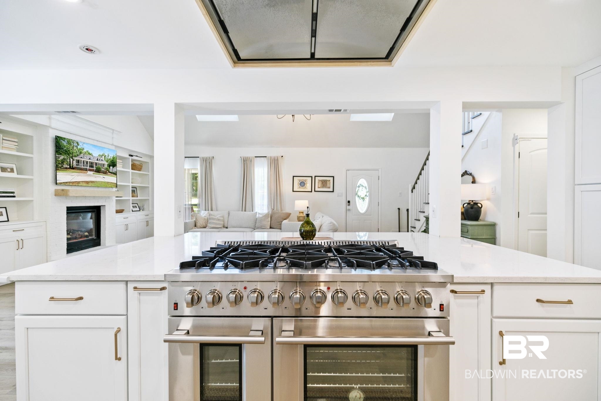 342 Ridgewood Drive Daphne, AL 36526 - Photo 4 of 36 Kitchen with double oven range, light hardwood / wood-style flooring, and white cabinetry
