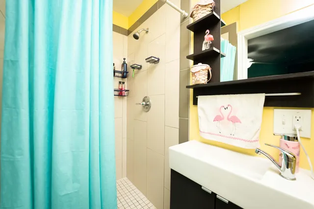 a bathroom with a sink vanity and a mirror