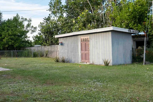 a backyard of a house with lots of green space