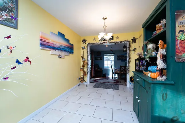 a view of living room with a baby crib