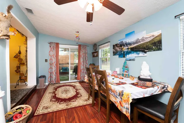 a view of a dining room with furniture window and outside view