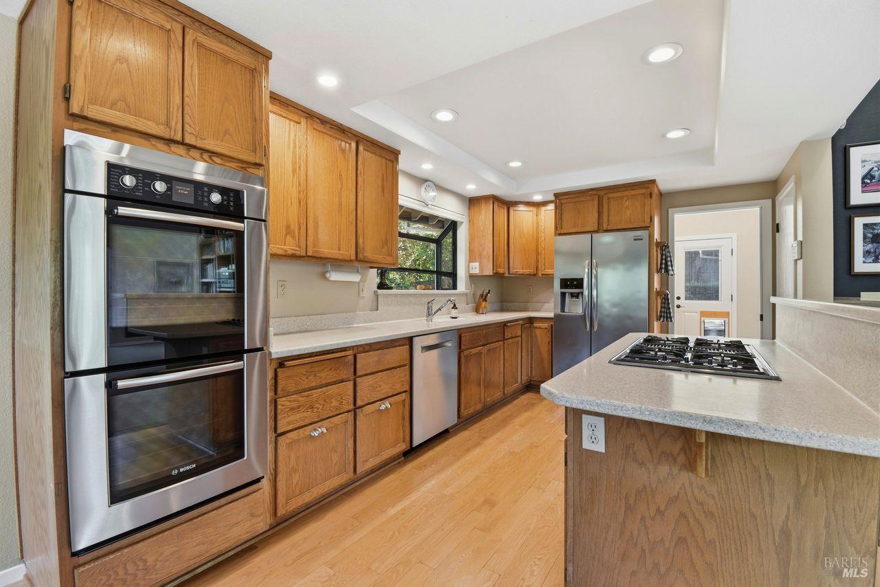 140 Massimo Circle Santa Rosa, CA 95404 - Photo 13 of 41 a kitchen with stainless steel appliances granite countertop a stove a sink and a refrigerator