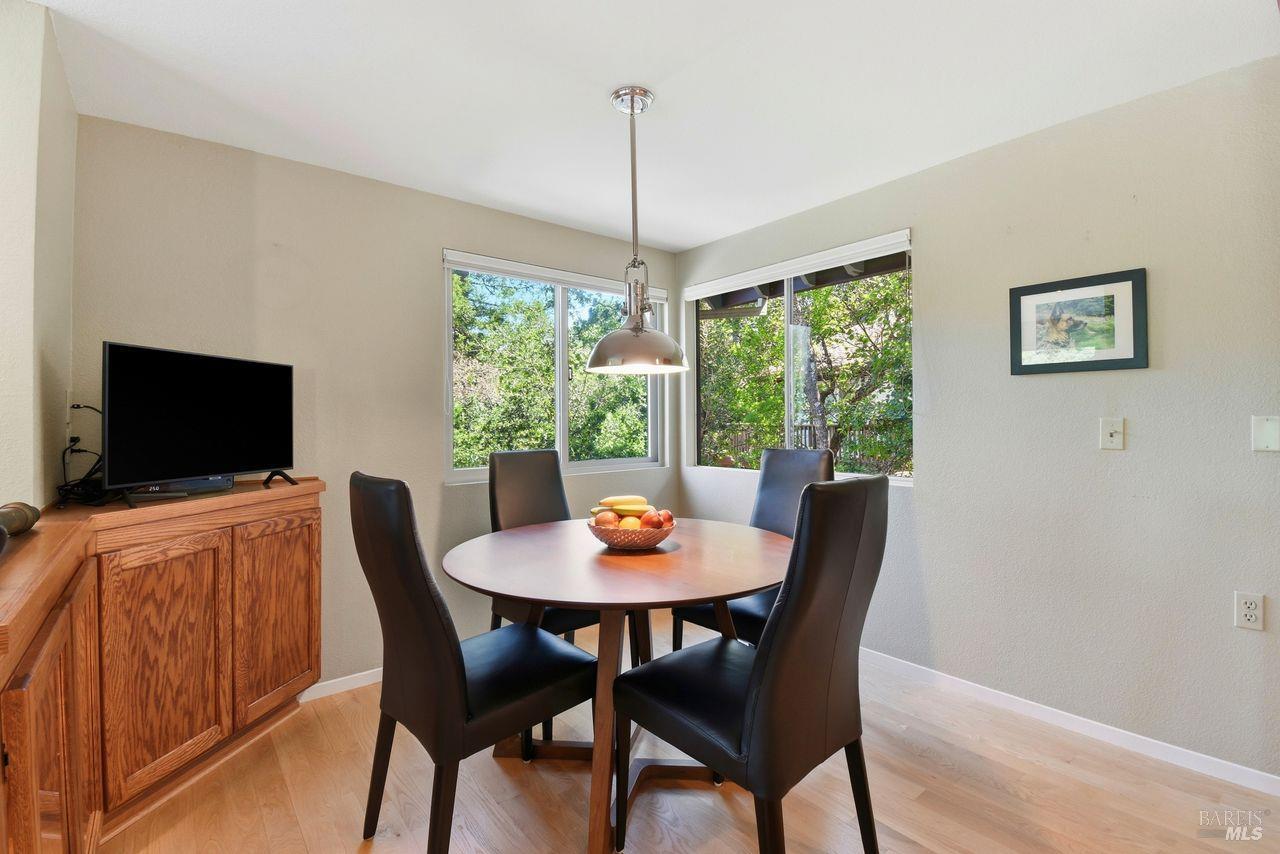 140 Massimo Circle Santa Rosa, CA 95404 - Photo 15 of 41 a dining room with furniture window and wooden floor